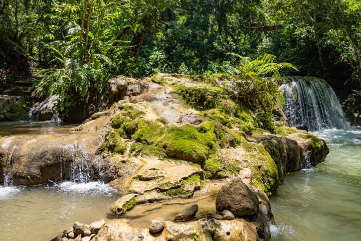 a large waterfall over a body of water