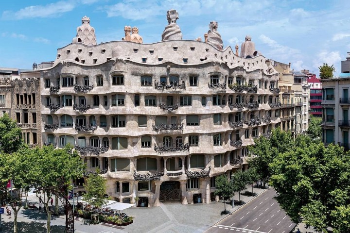 a large building with Casa Milà in the background