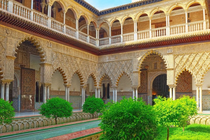 a large stone statue in front of a building