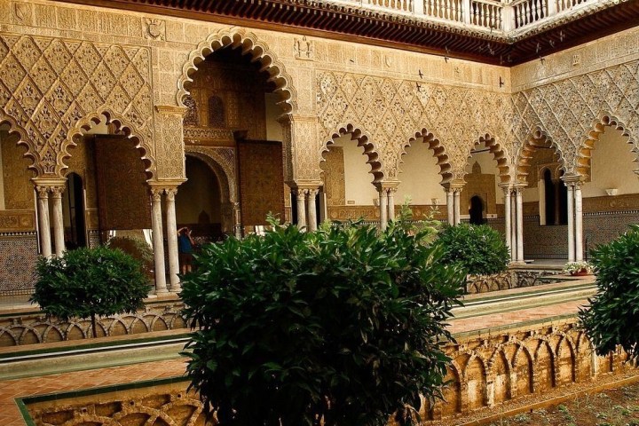 a large stone statue in front of a building