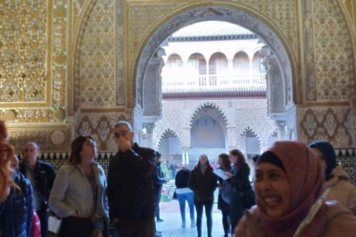 a group of people standing in front of a building