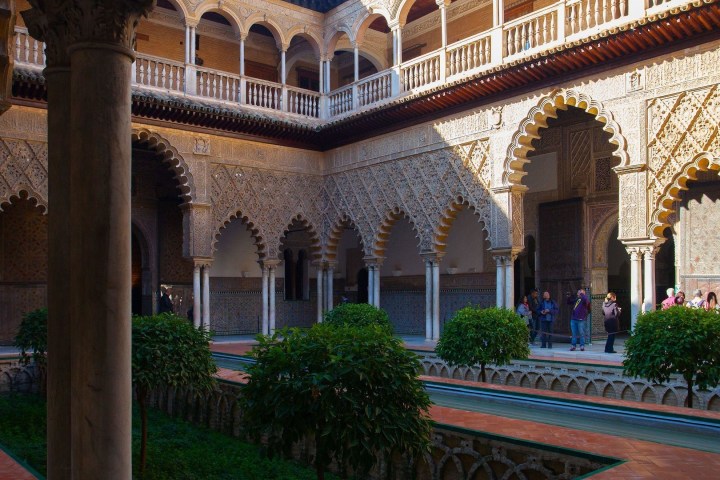 a large stone statue in front of a building