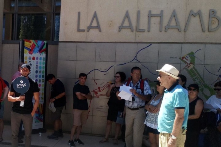 a group of people standing in front of a building