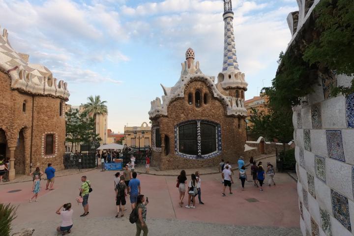 a group of people walking in front of a building