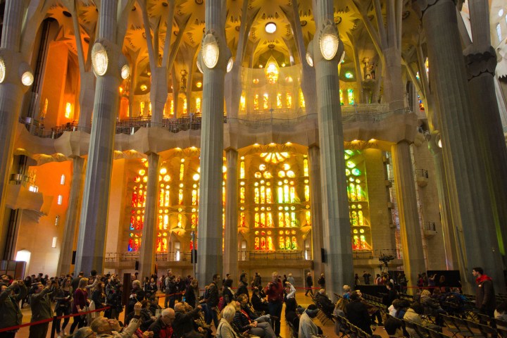 a crowd of people standing in front of a building