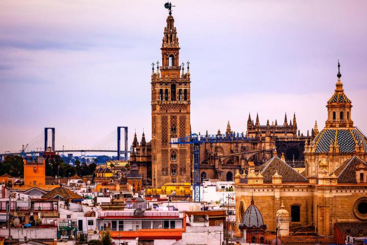a large clock tower towering over the city of london