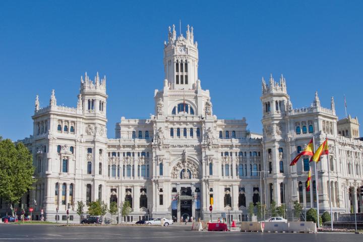 a large building with Plaza de Cibeles in the background