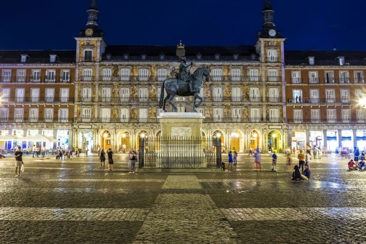 a group of people standing in front of a building