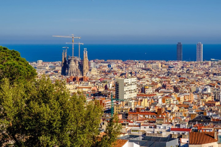 a large body of water with a city in the background
