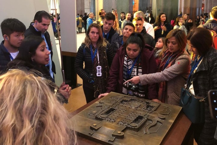 Daniel Skye et al. standing in front of a crowd posing for the camera