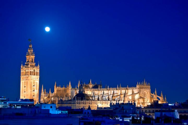 a large clock tower towering over the city of london