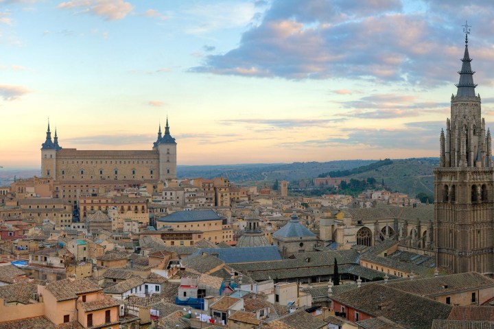 a group of people sitting in front of a castle