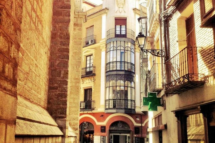 a close up of a stone building that has a narrow street