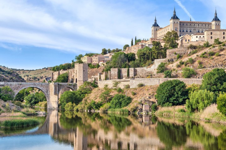 a castle on a bridge over a body of water