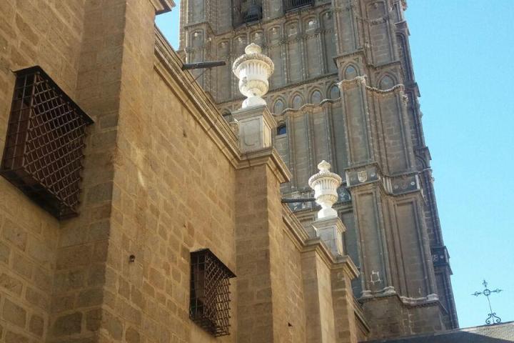 a large tall tower with a clock on the side of a building