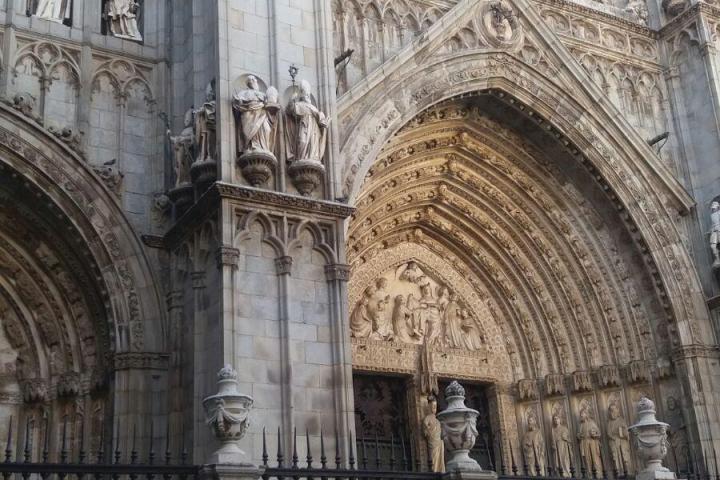 a large stone statue in front of a building