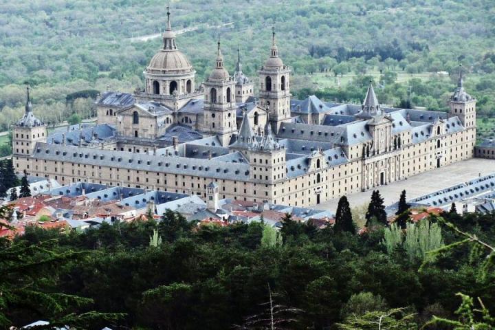 a castle on a hill in front of a building