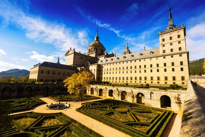 a castle with a clock tower in front of a building