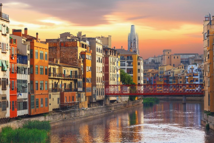 a body of water with a city in the background