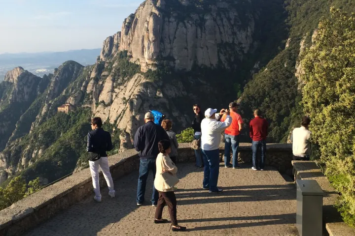 a group of people on a mountain road