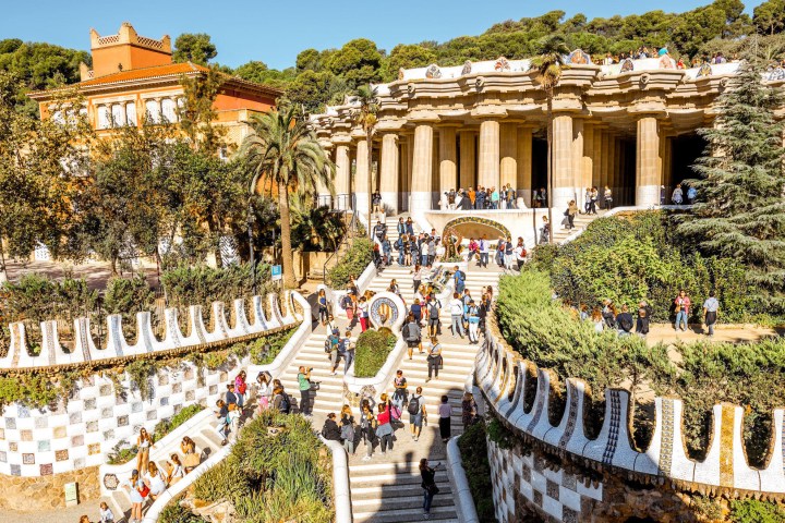 a group of people in front of Park Güell