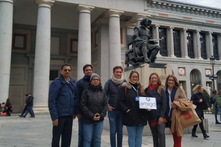 a group of people standing in front of a building