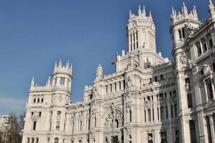 a large clock tower in front of a building
