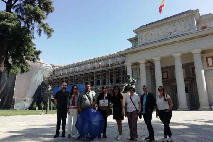 a group of people standing in front of a building