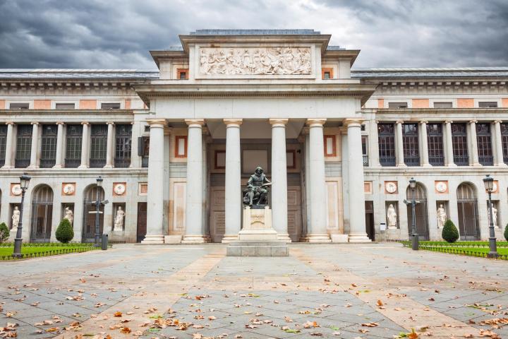 a large stone building with Museo del Prado in the background