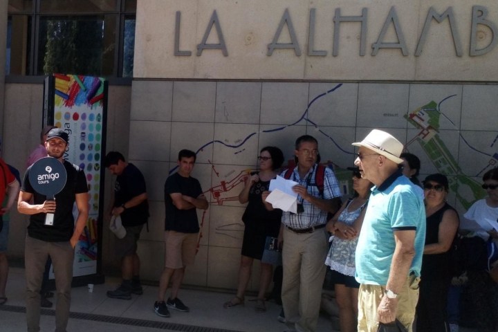a group of people standing in front of a building