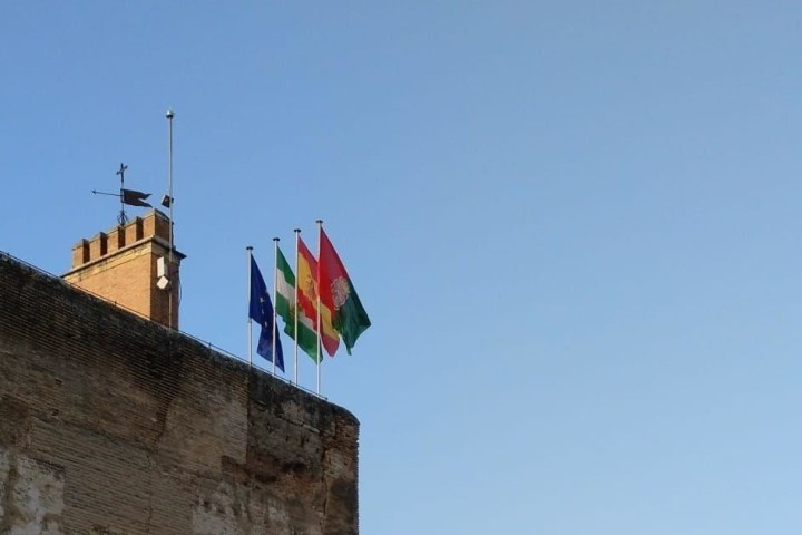 a tower that has a sign on the side of a building