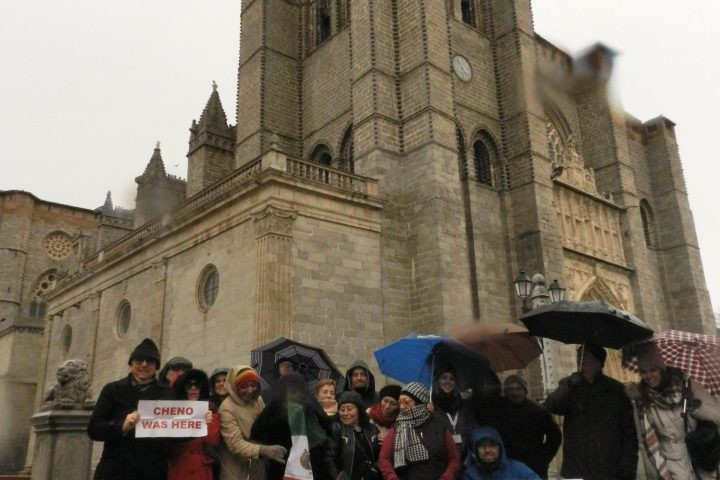a group of people standing in front of a building