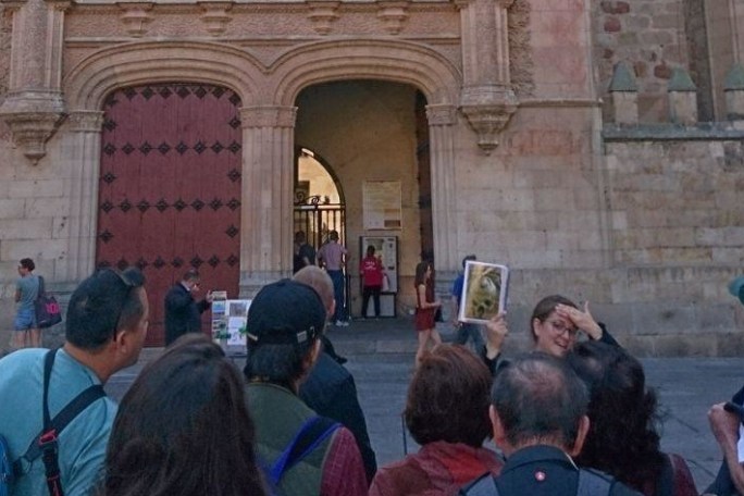 a group of people standing in front of a building