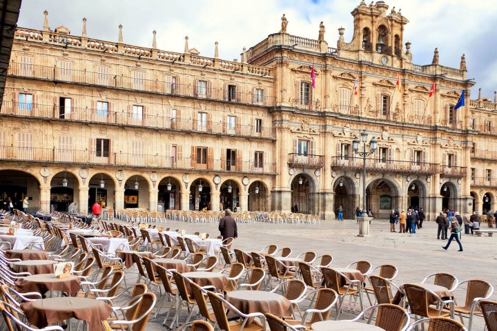 a group of people standing in front of a building