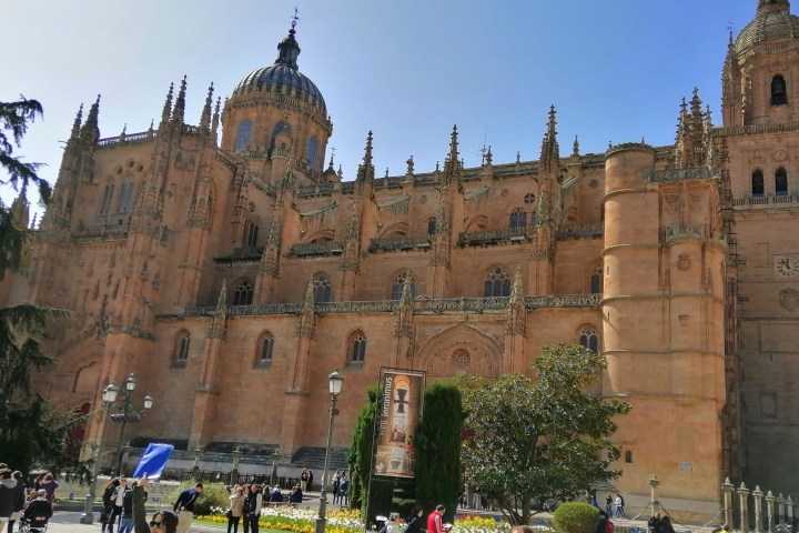 a group of people in front of a brick building