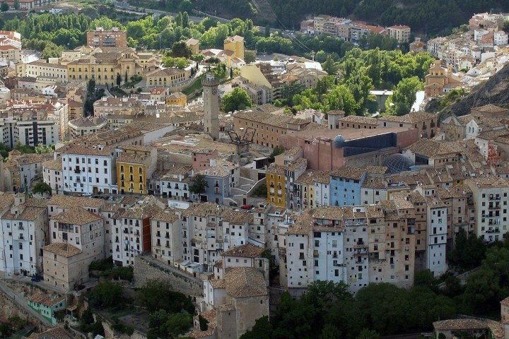 a castle like building with a mountain in the background