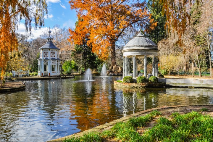 a small pond in front of a house