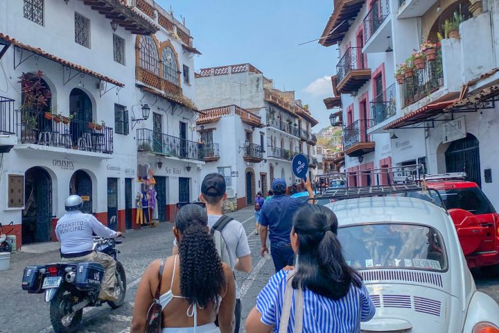 a group of people standing in front of a building