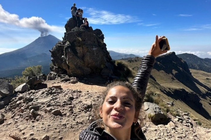 a person standing on a rocky hill