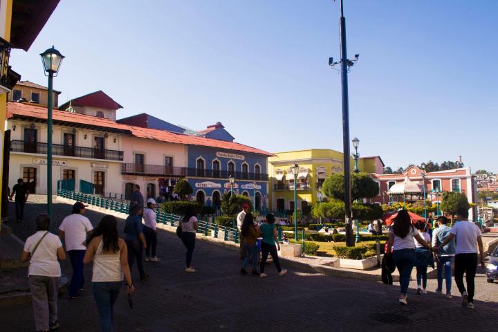 a group of people walking down a street