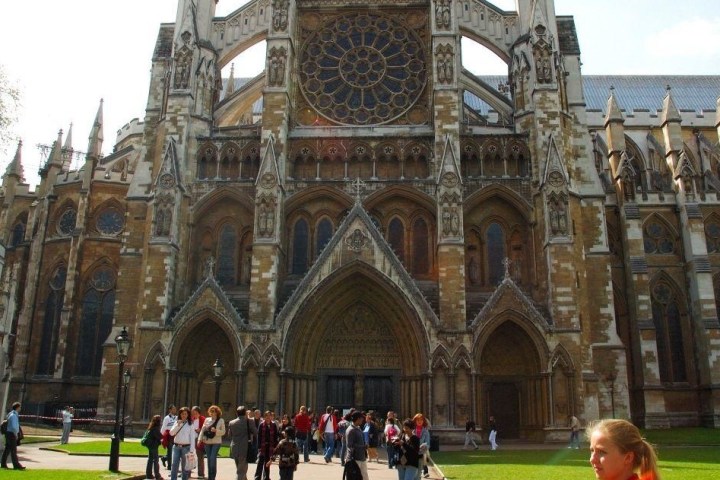a group of people standing in front of a church