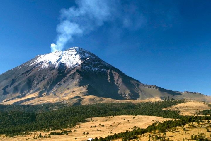 a large mountain in the background