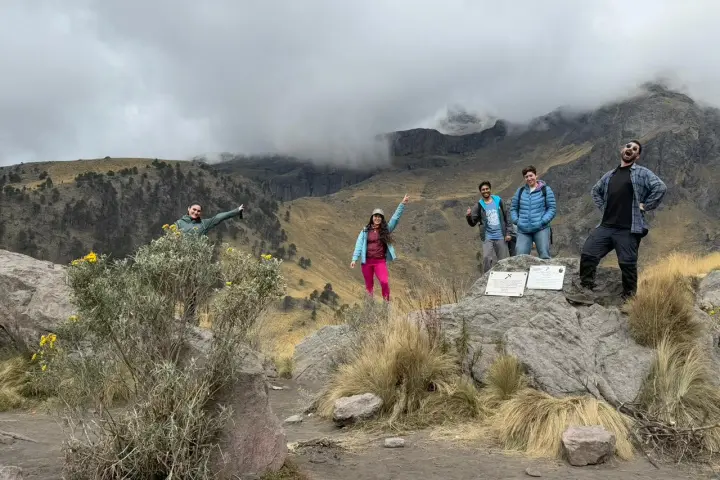 a group of people in a dirt field