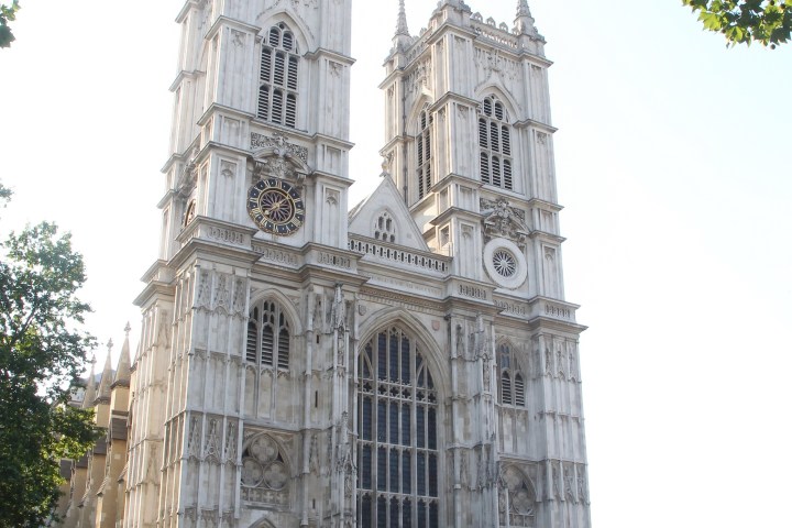 a large stone statue in front of Westminster Abbey