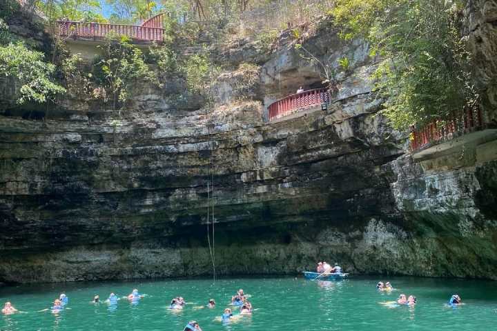 a group of people swimming in a body of water