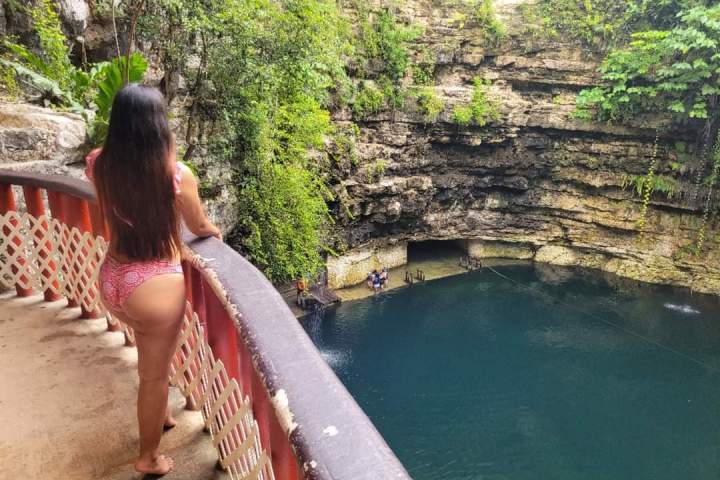 a person sitting next to a river