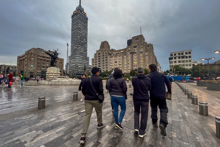 a group of people walking down a street