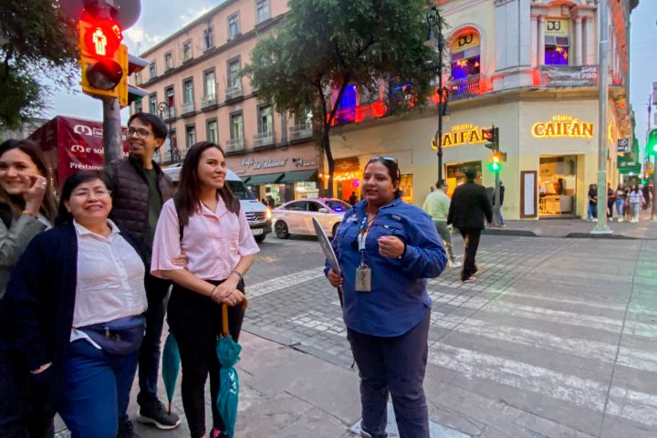 a group of people walking down the street