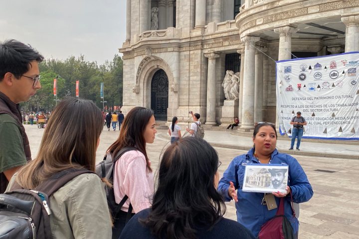 a group of people standing in front of a building