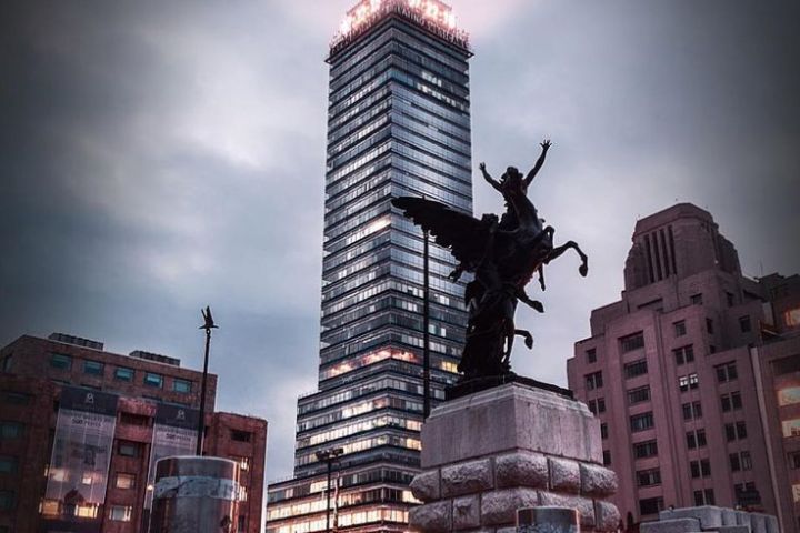 a large clock tower towering over a city